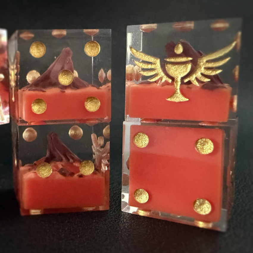 Four SKU002 dice stacked against a black background